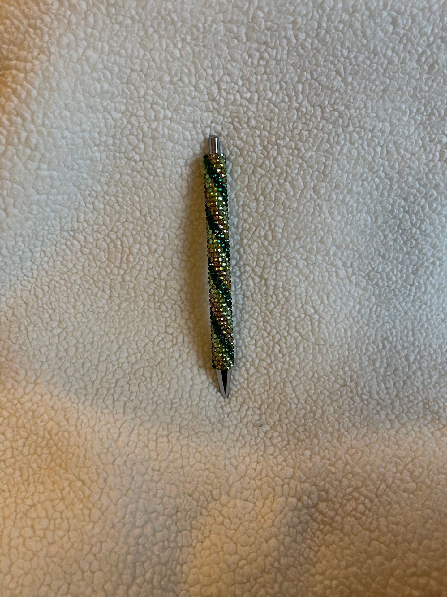 Rhinestone Pen with a variety of green colors in a swirl pattern