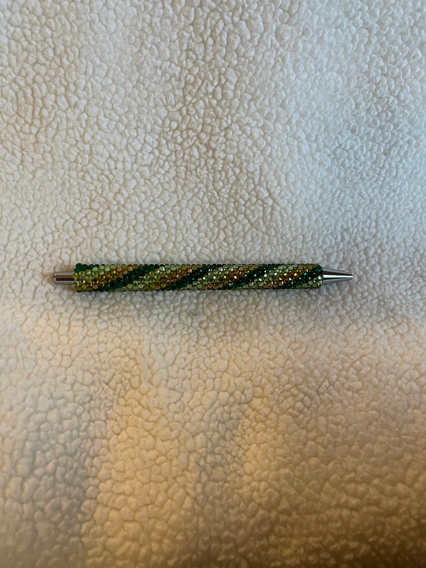 Rhinestone Pen with a variety of green colors in a swirl pattern