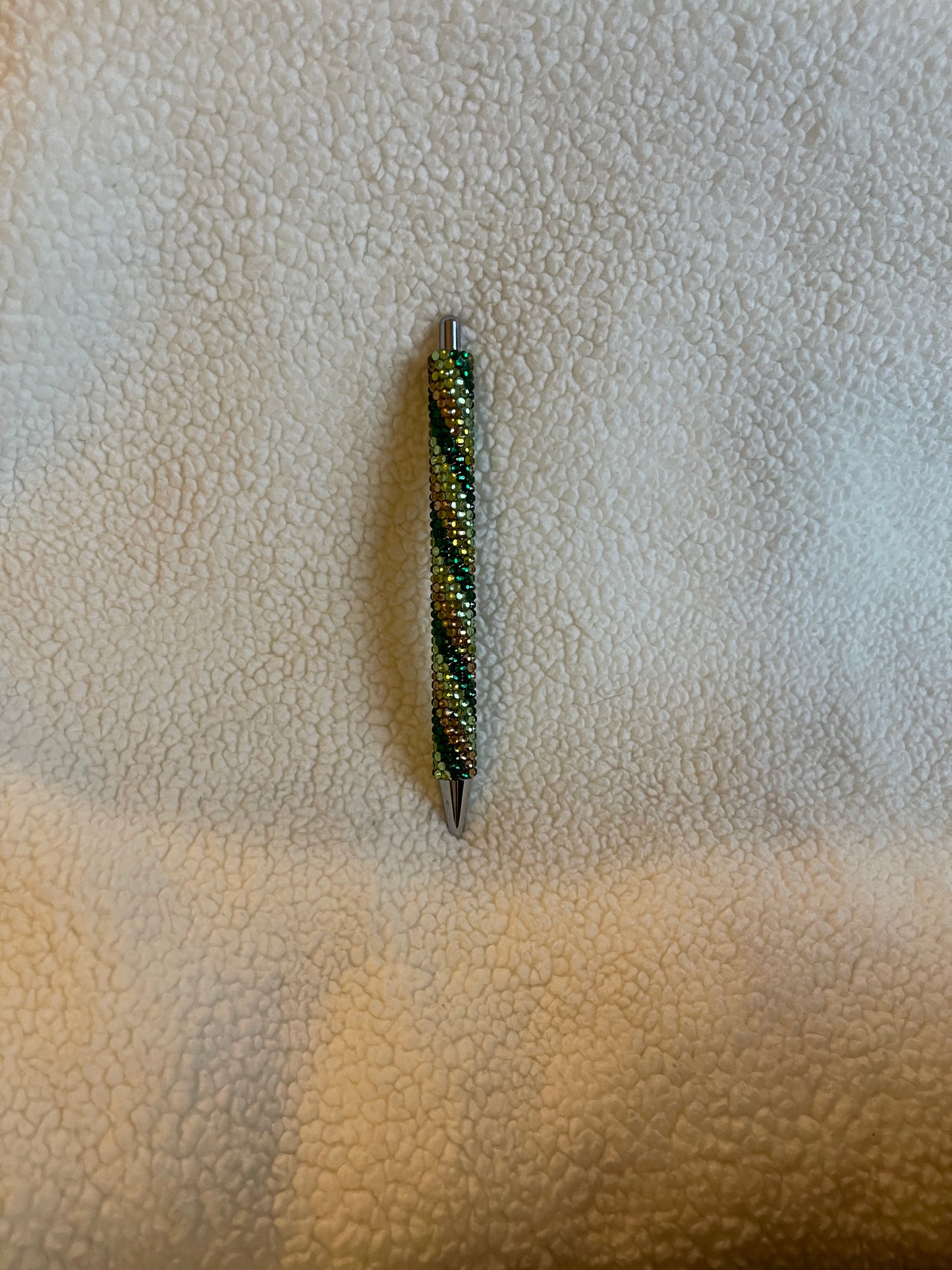 Rhinestone Pen with a variety of green colors in a swirl pattern